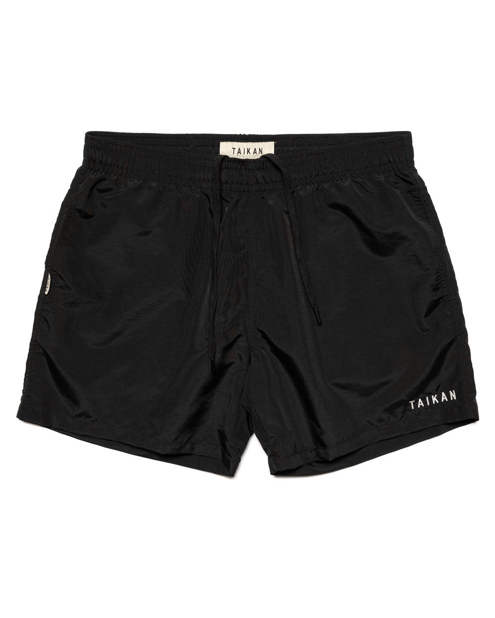 the Taikan Nylon Shorts in Black laying flat on a white backgroun
