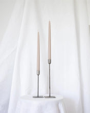 Load image into Gallery viewer, a pair of Socco Designs Taper Candles in oat in two tapers of varying heights against a white sheet background
