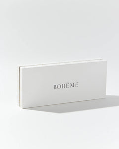 Boheme Fragrances Wanderlust Discovery Candle Set box shown on its side on an angle