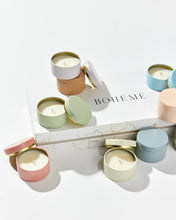 Load image into Gallery viewer, Boheme Fragrances Wanderlust Discovery Candle Set box with multi coloured candle pots, some with lids off scattered around
