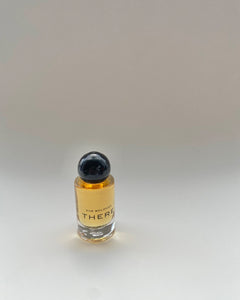 Olivine Atelier She Belongs There Perfume Oil in glass bottle against neutral background